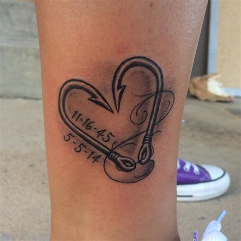 This delicate tattoo incorporates curvy lines and twisted patterns to create a hook-like pattern. . Heart fishing hook tattoo